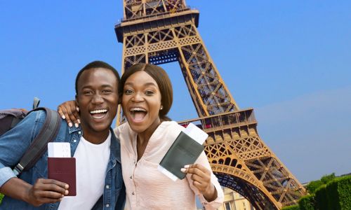 African couples on tourist holding passport in paris