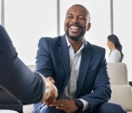 Cheerful Nigerian business man in Visa consultation meeting at TimTamd Travels